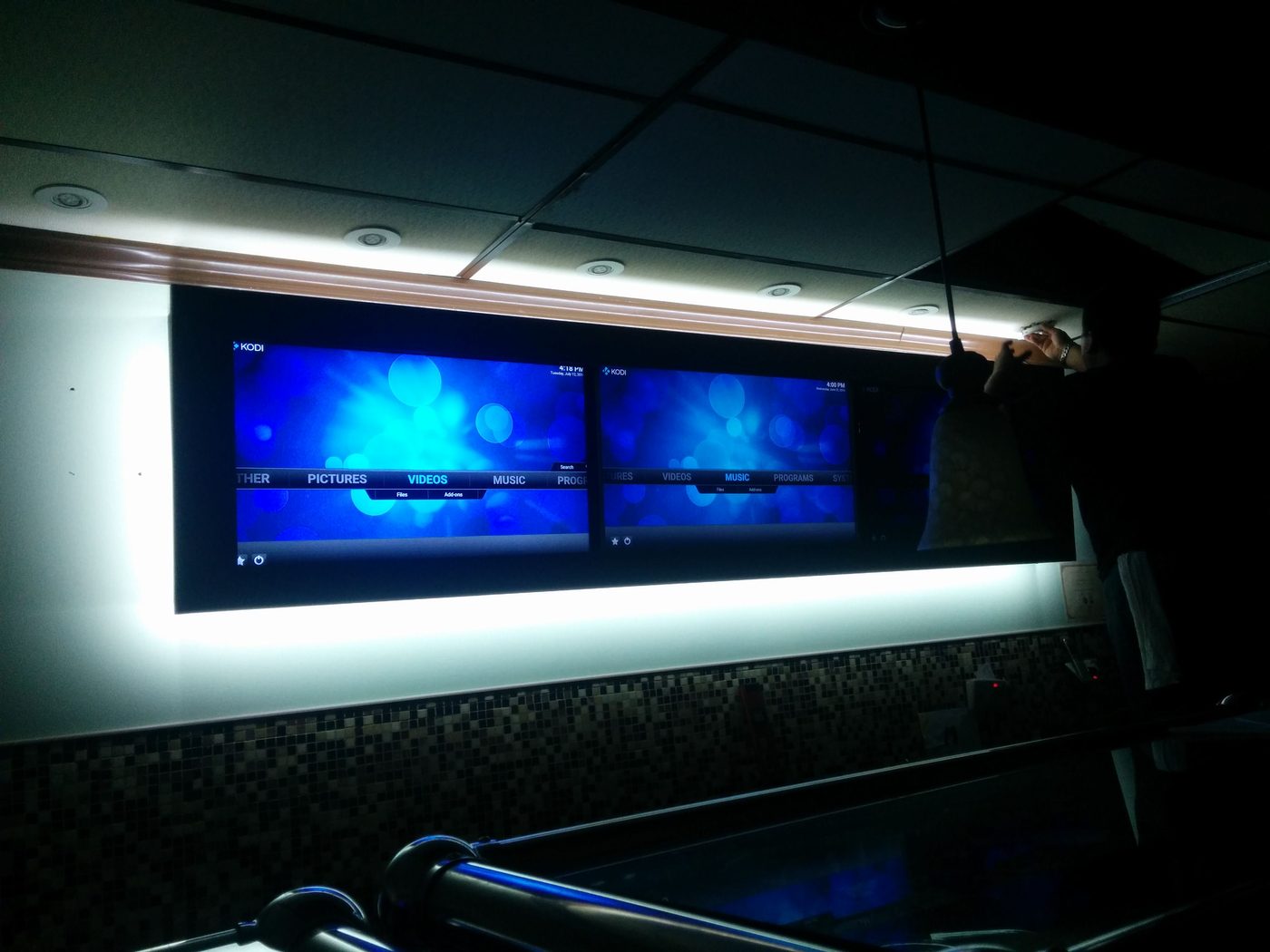 Digital menu boards mounted on wall
